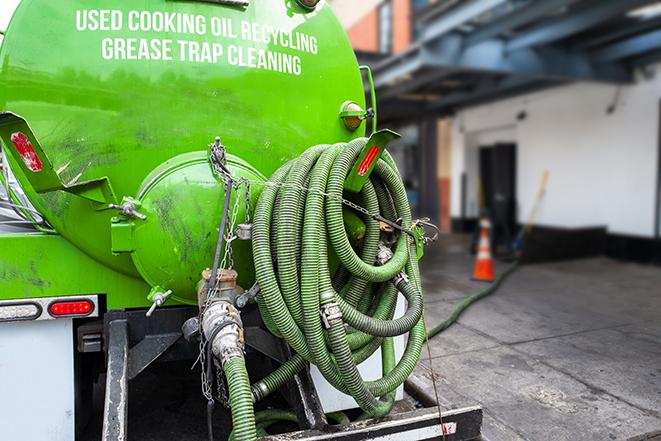 a service truck pumping grease from a restaurant's grease trap in Chatsworth